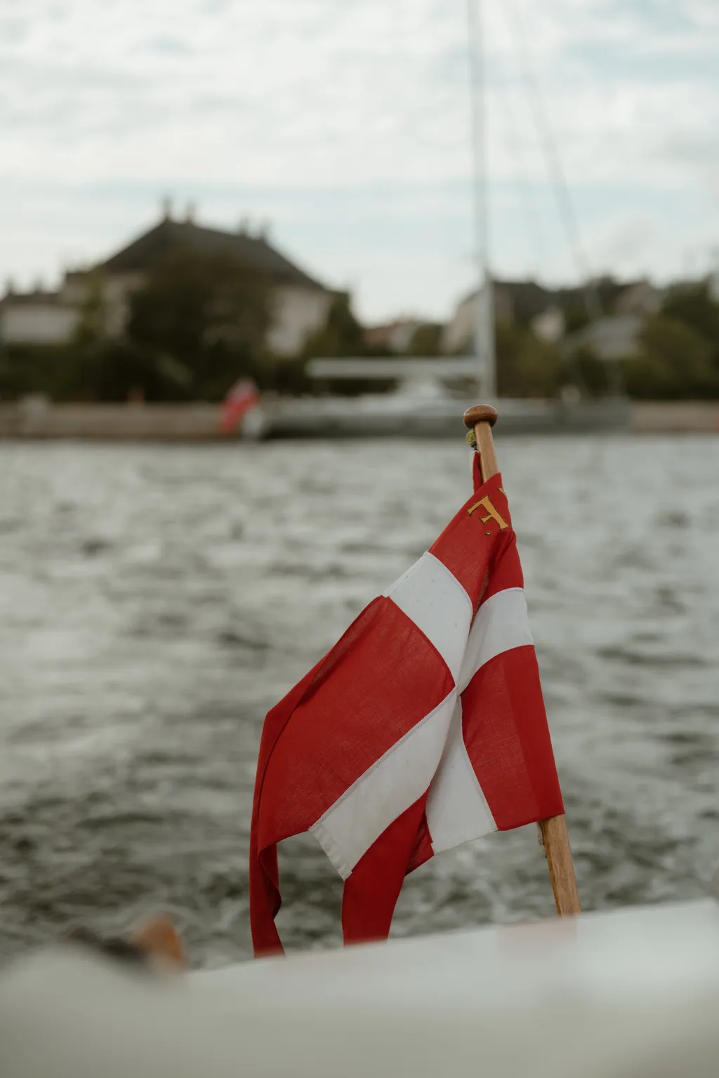 The Danish flag at the stern of the boat
